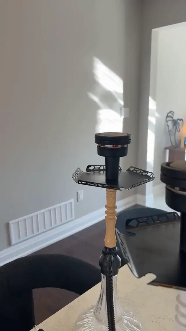 Hookah set up and lit in a private room before guests arrive